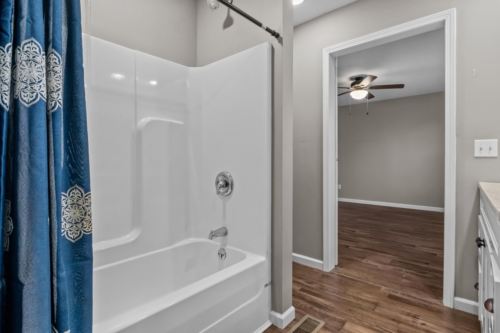358 Able Street Big Sandy, TN 38221 - Photo 24 of 31 a bathroom with a bathtub and a shower