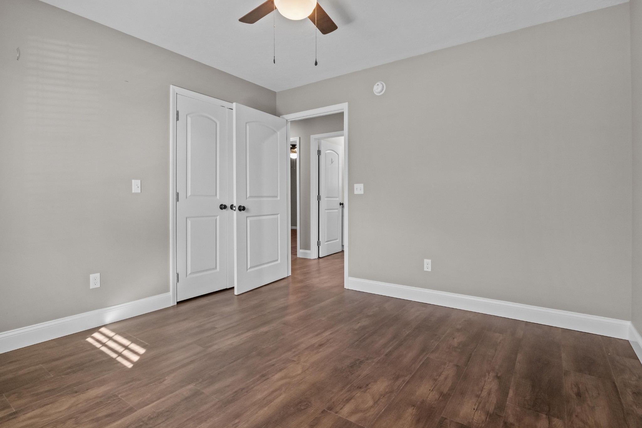 358 Able Street Big Sandy, TN 38221 - Photo 29 of 31 wooden floor in an empty room