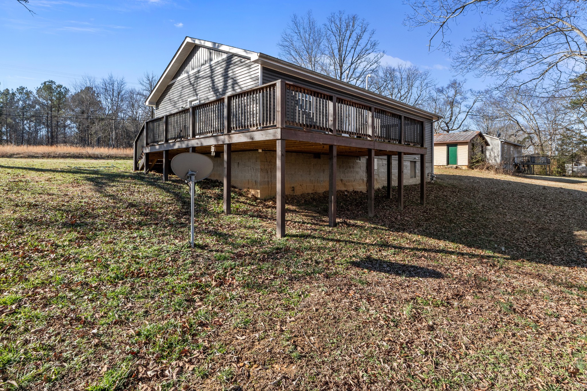 358 Able Street Big Sandy, TN 38221 - Photo 5 of 31 a view of a house with a yard