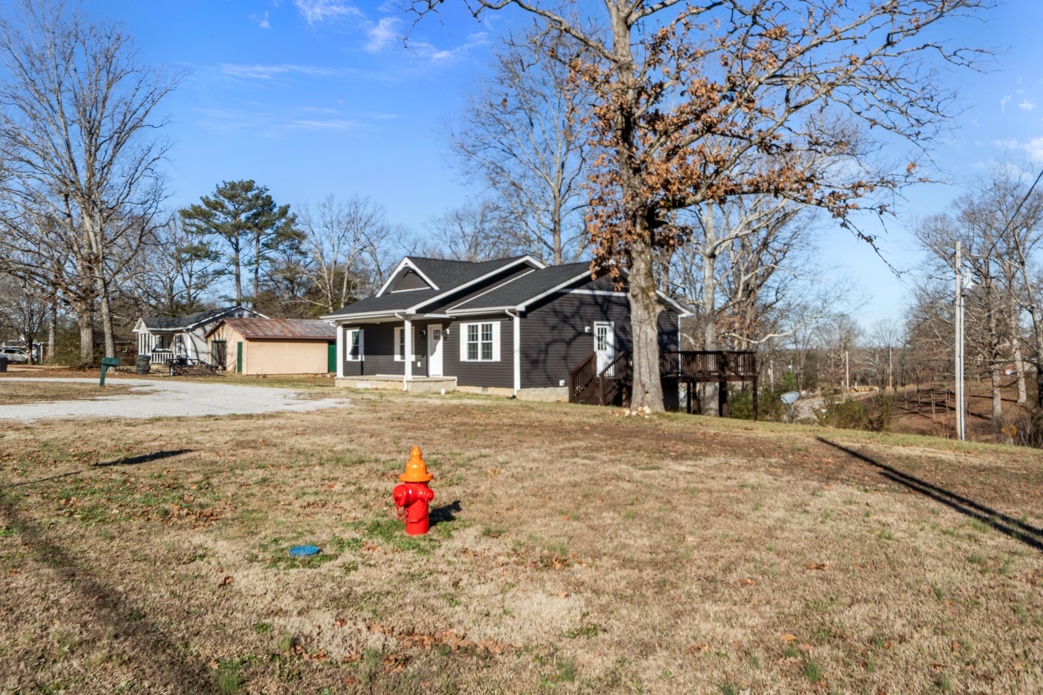358 Able Street Big Sandy, TN 38221 - Photo 6 of 31 a front view of a house with a yard