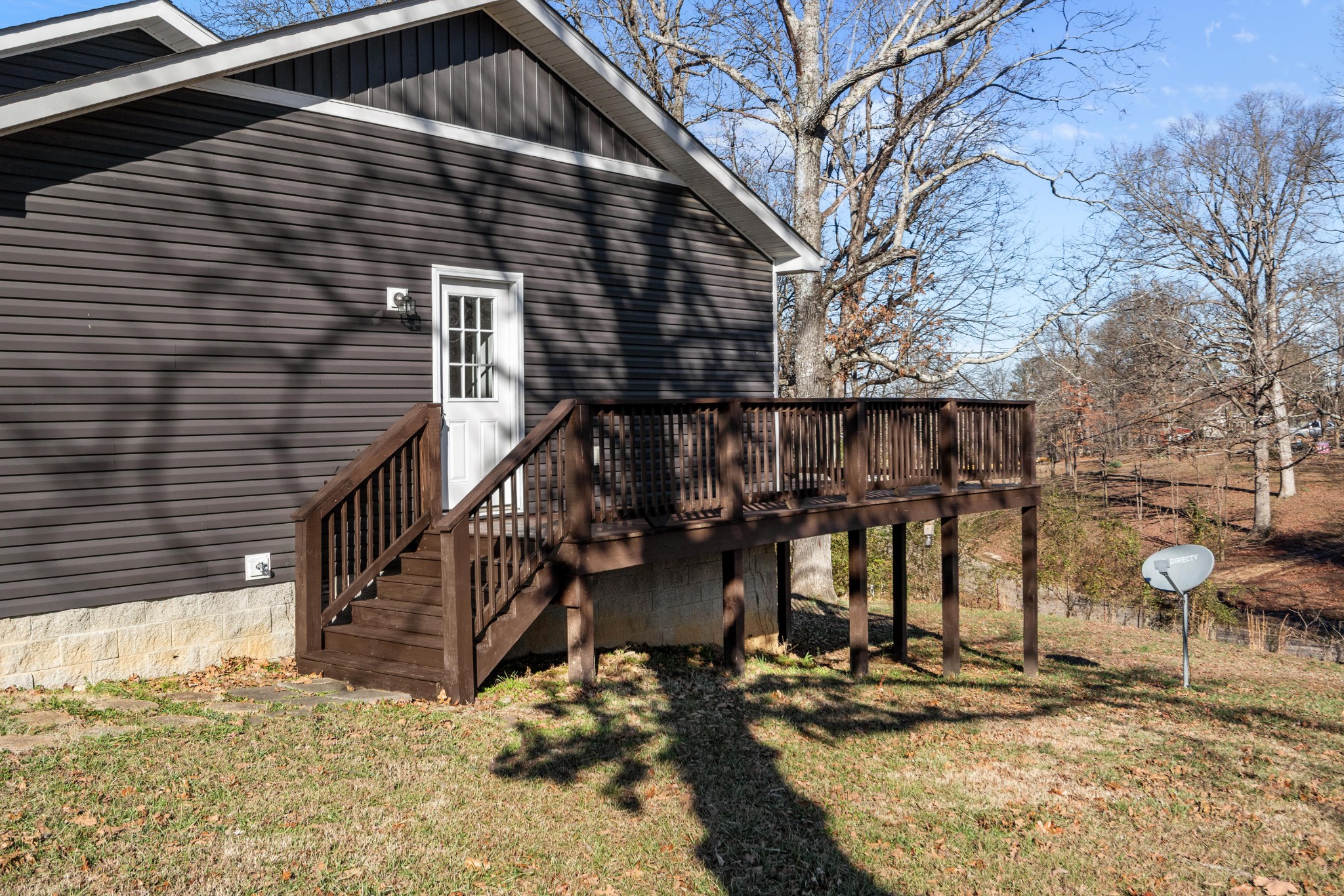 358 Able Street Big Sandy, TN 38221 - Photo 9 of 31 a view of wooden house with large trees