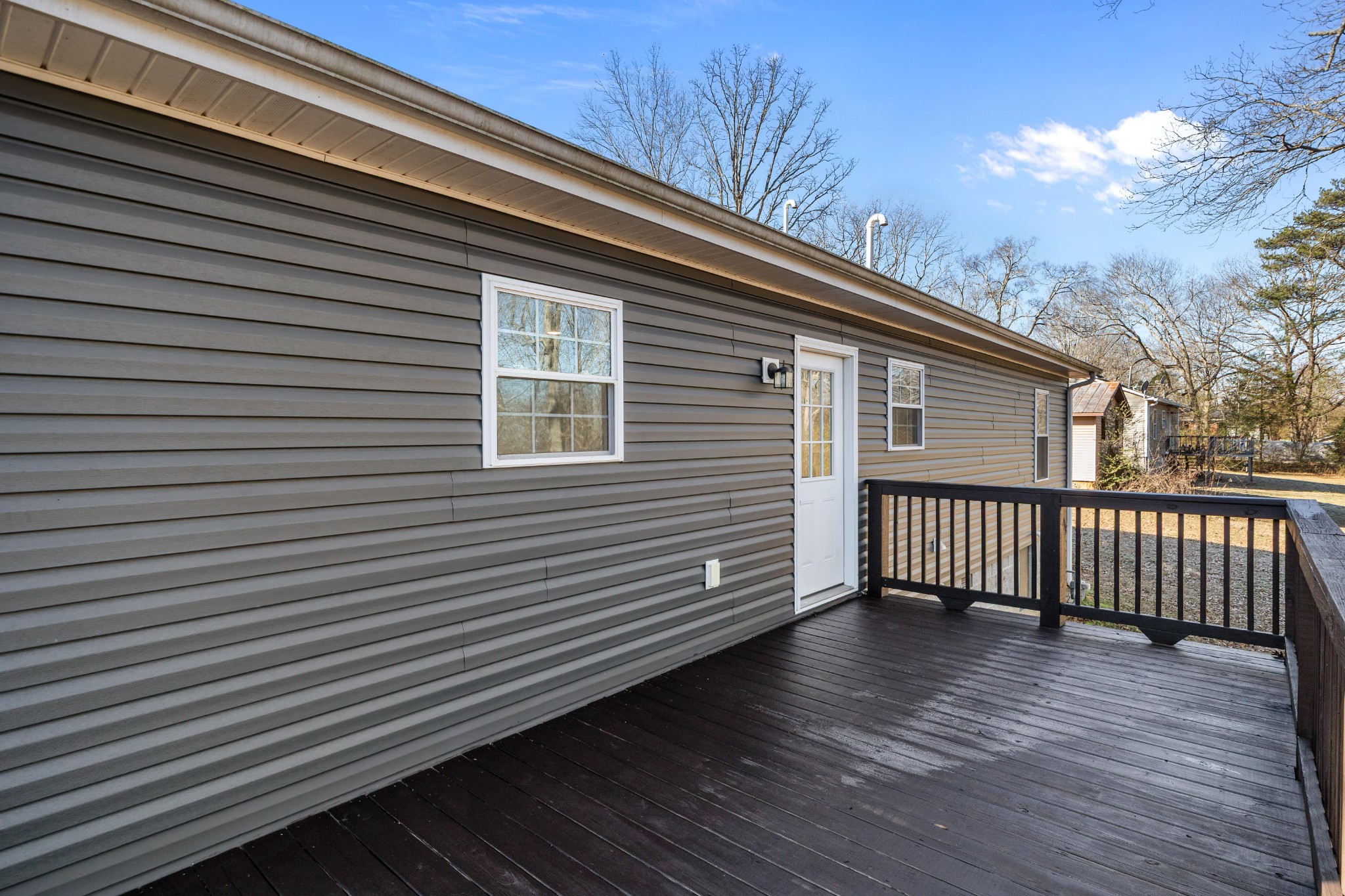 358 Able Street Big Sandy, TN 38221 - Photo 10 of 31 a view of a house with a roof deck