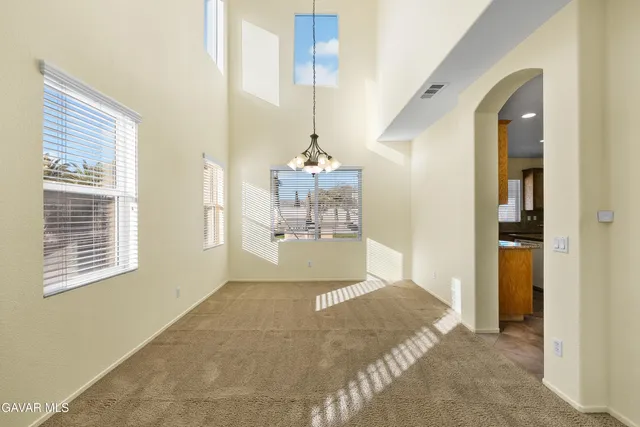 a kitchen with refrigerator cabinets and a sink