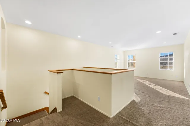 a bathroom with a shower sink and mirror