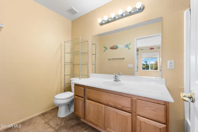 a view of swimming pool with outdoor seating and palm trees