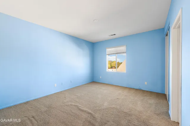 an aerial view of a house with a swimming pool