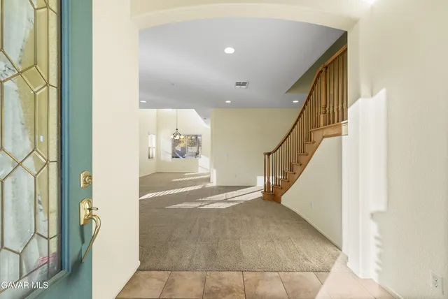 a view of an entryway with stairs