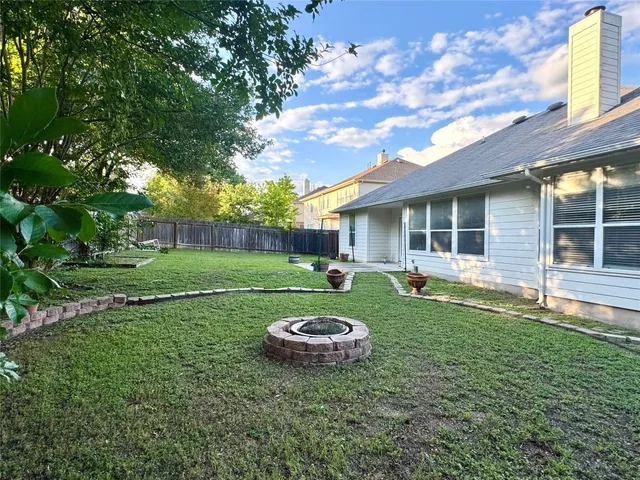 a couple of table and chairs in backyard