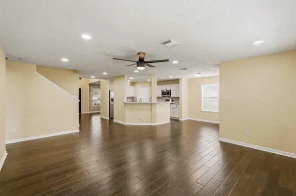 a view of kitchen with furniture and wooden floor