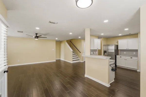 a view of kitchen with cabinets and wooden floor