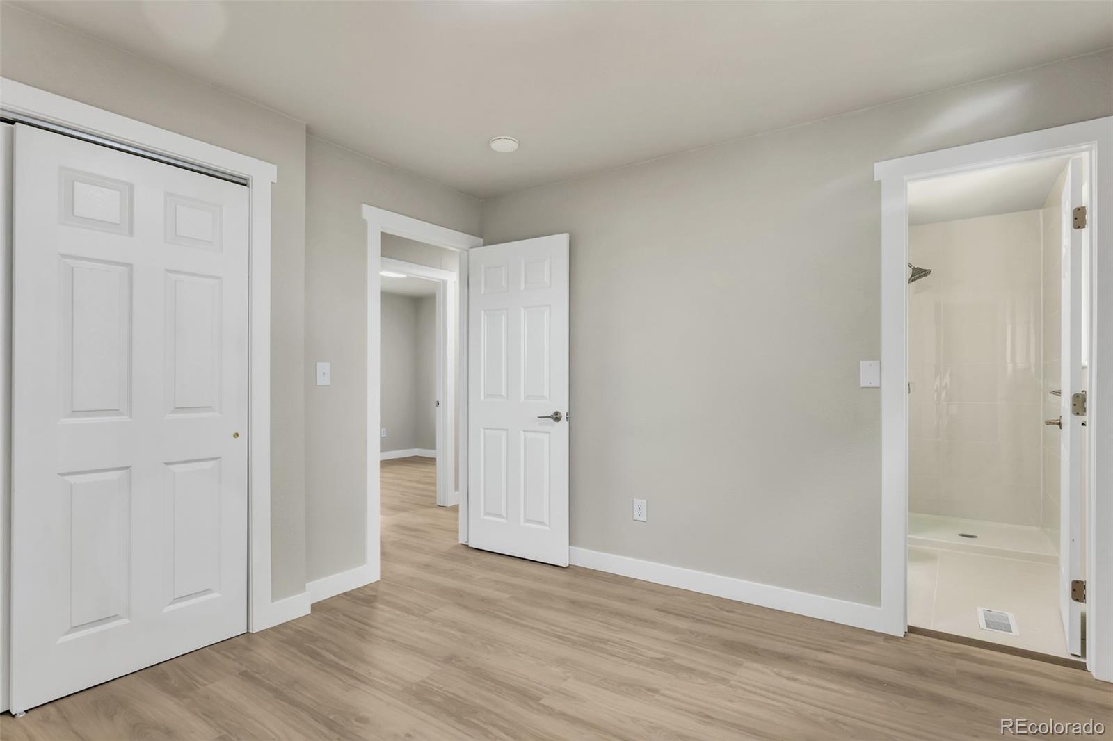 2787 South Helena Way Aurora, CO 80013 - Photo 15 of 26 a view of an empty room and wooden floor