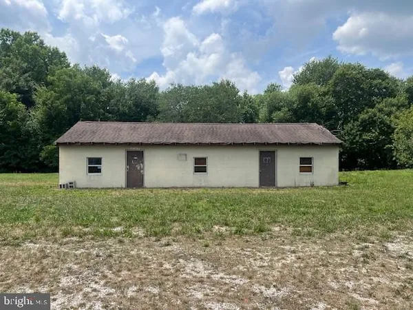 a house that has a lot of trees in it