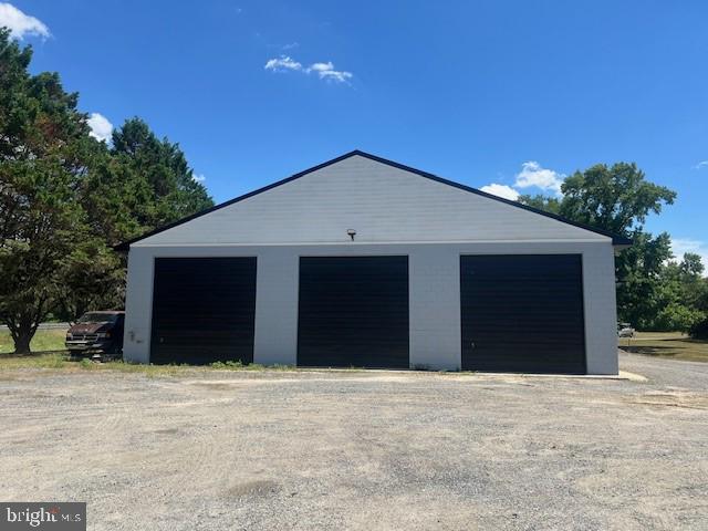 225 Moonglow Road Fruitland, MD 21826 - Photo 2 of 15 a front view of a house with a yard and garage