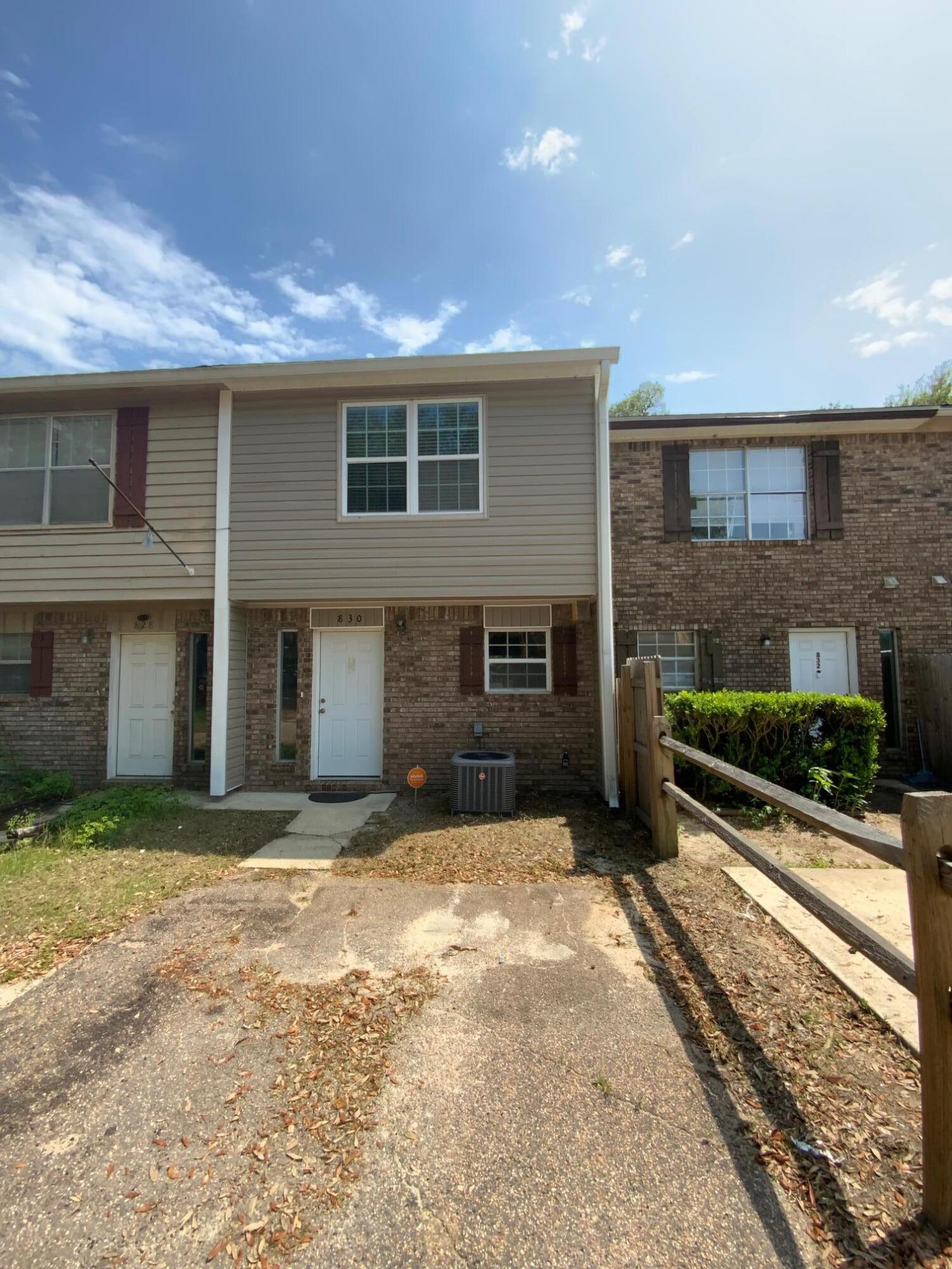 a view of a house with a yard and a garage