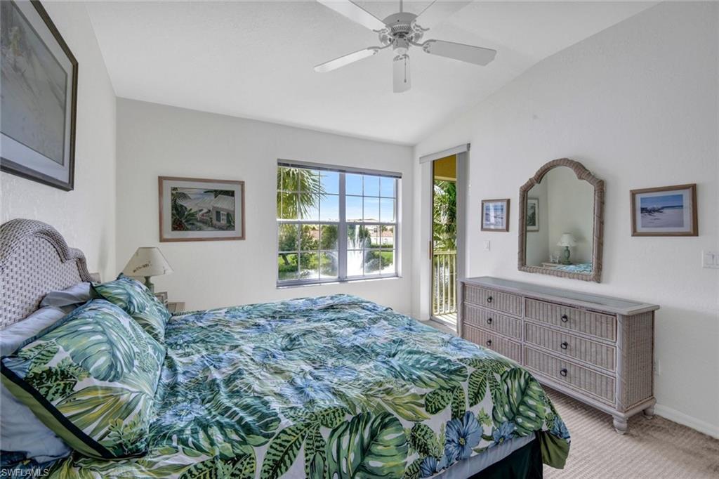 10711 Halfmoon Shoal Road, Unit 203 Estero, FL 34135 - Photo 12 of 25 a bedroom with a bed and a dresser