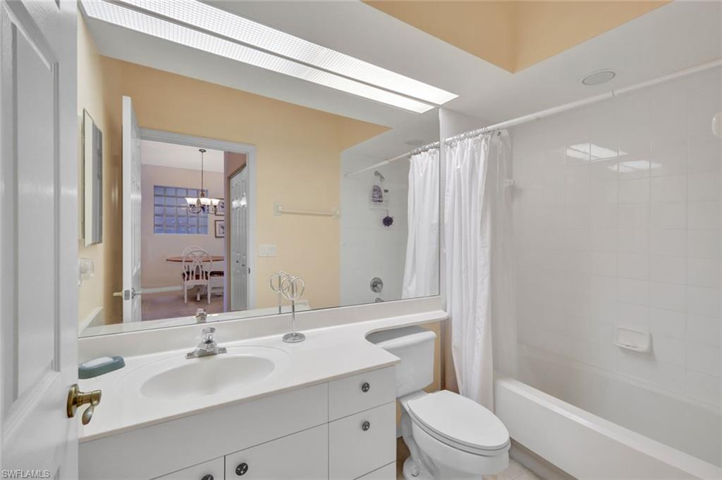 10711 Halfmoon Shoal Road, Unit 203 Estero, FL 34135 - Photo 16 of 25 a bathroom with a sink a toilet and shower