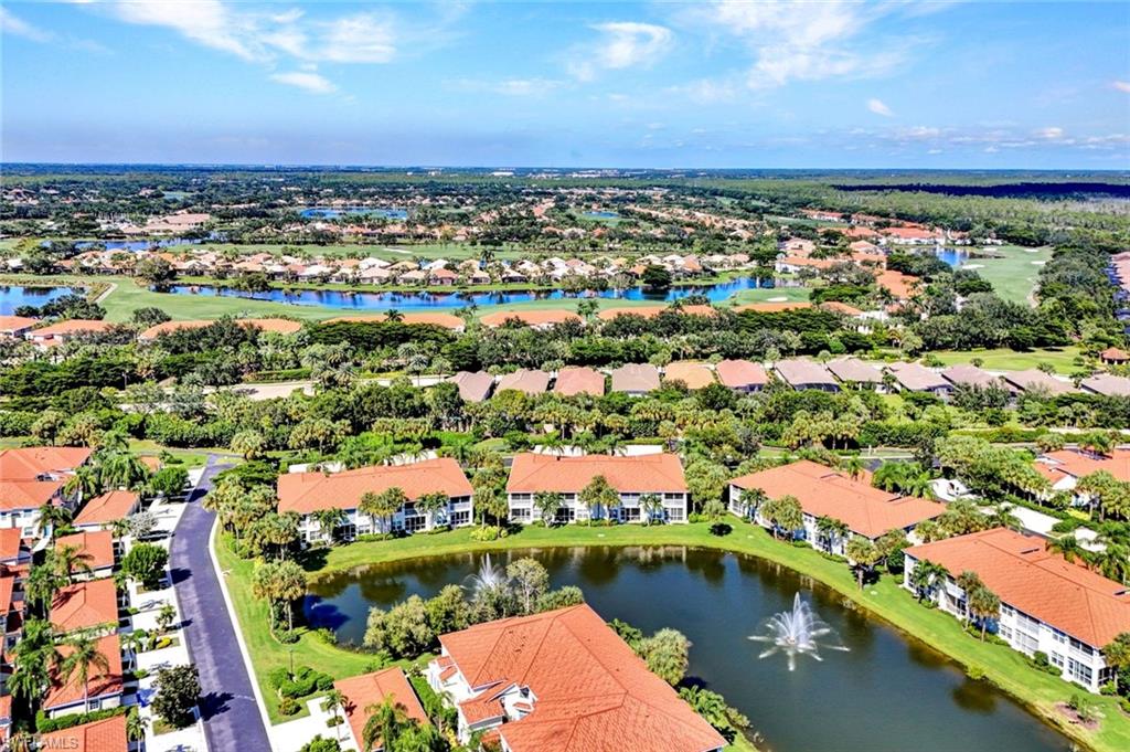 10711 Halfmoon Shoal Road, Unit 203 Estero, FL 34135 - Photo 22 of 25 an aerial view of residential building and lake