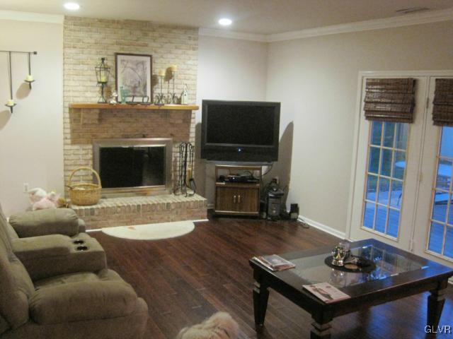 Family Room with wood burning fireplace and door t