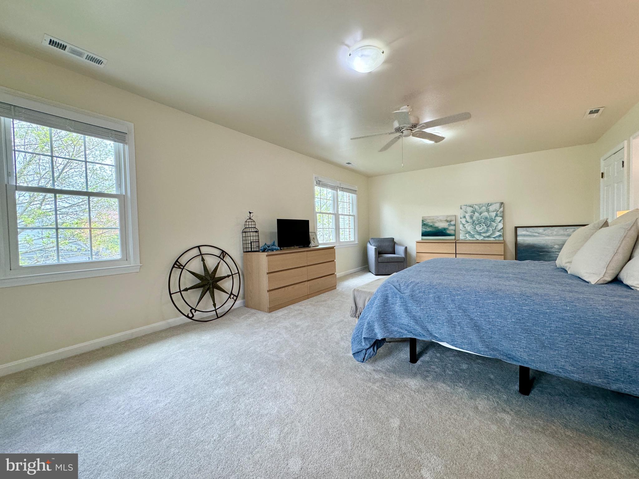6728 Churchill Road McLean, VA 22101 - Photo 17 of 32 a spacious bedroom with a bed and a closet