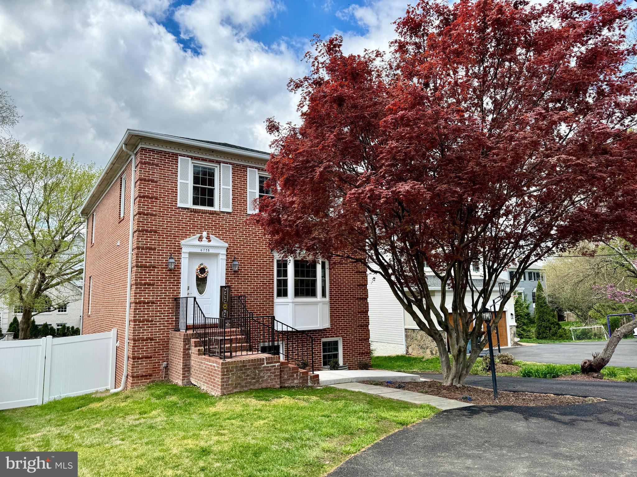 6728 Churchill Road McLean, VA 22101 - Photo 2 of 32 front view of house with a yard