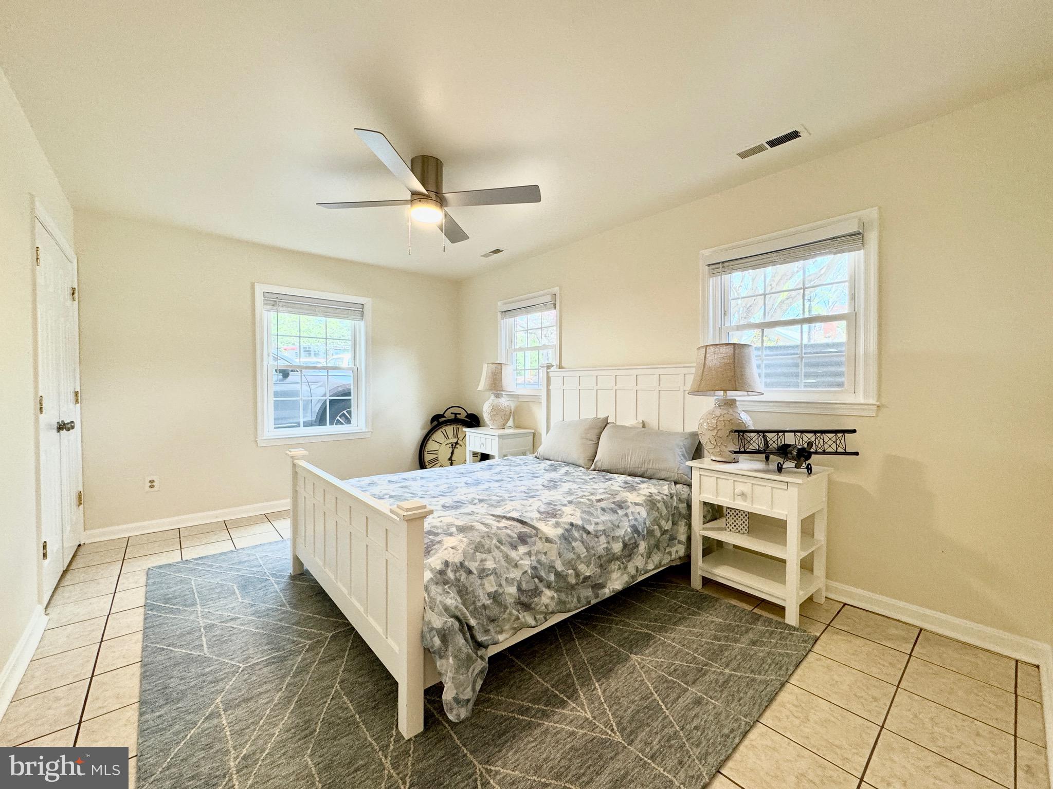 6728 Churchill Road McLean, VA 22101 - Photo 22 of 32 a bedroom with a bed and a window