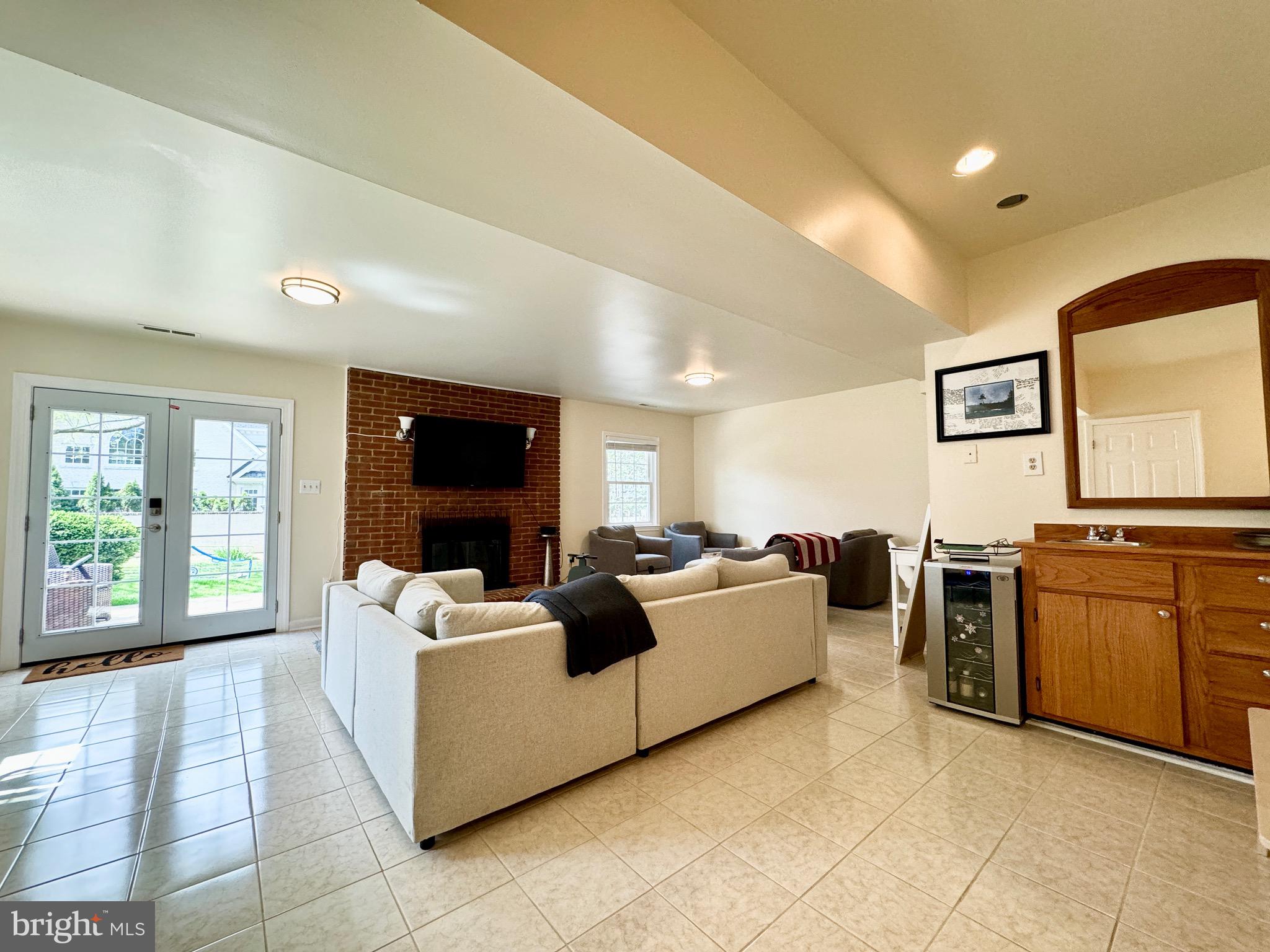 6728 Churchill Road McLean, VA 22101 - Photo 24 of 32 a living room with furniture and a flat screen tv