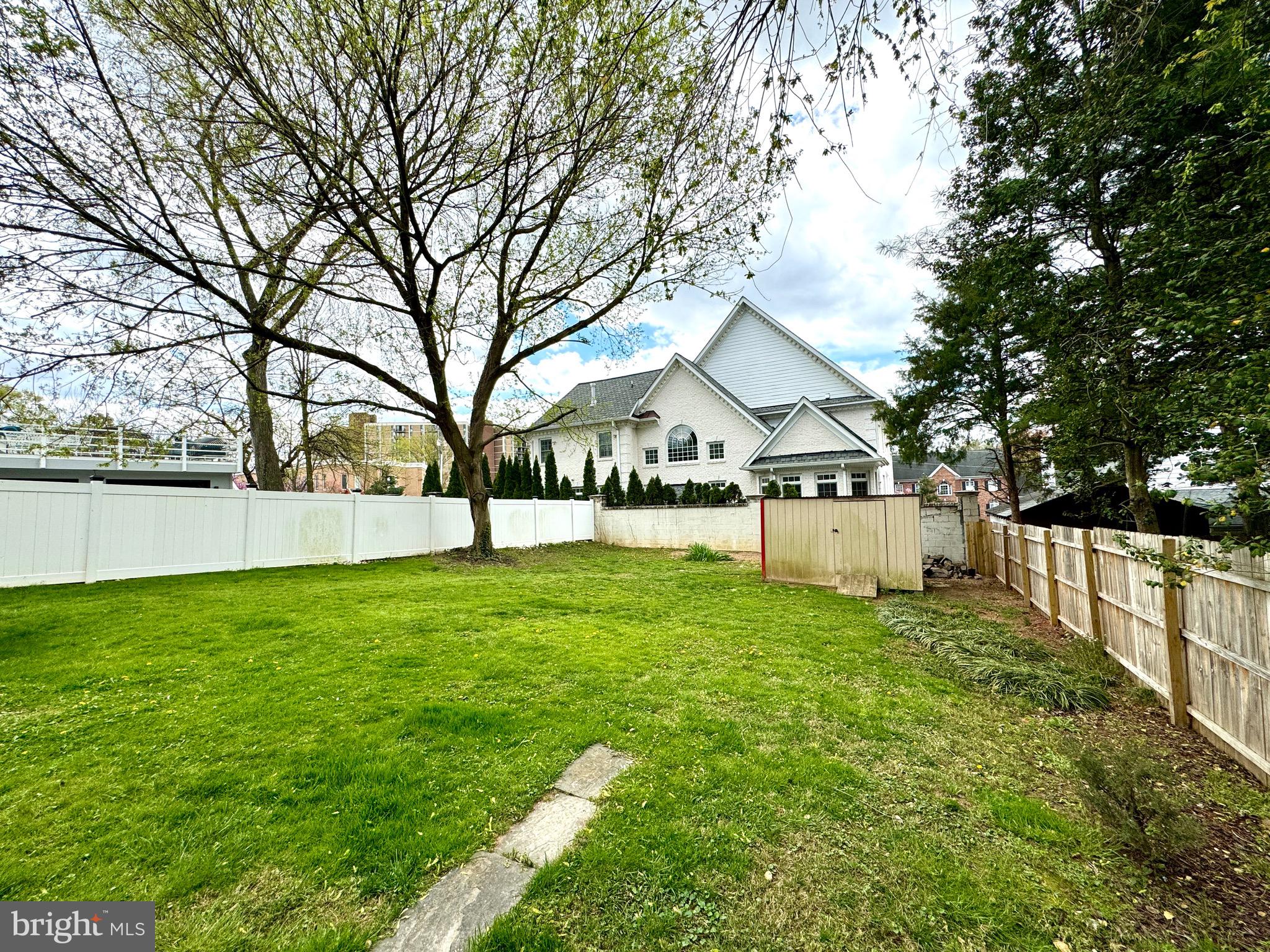 6728 Churchill Road McLean, VA 22101 - Photo 27 of 32 a view of a house with backyard and tree