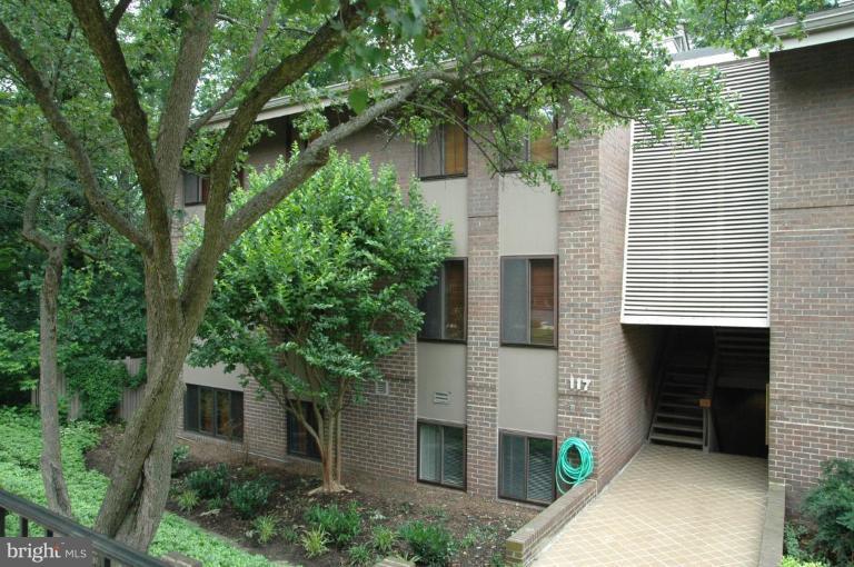 front view of a house with a tree