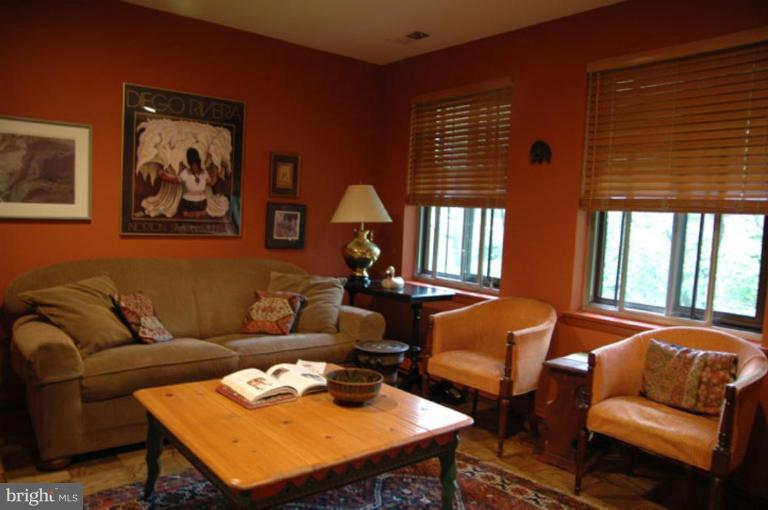 117 Cross Keys Road, Unit R117E Baltimore, MD 21210 - Photo 12 of 22 a living room with furniture and a large window