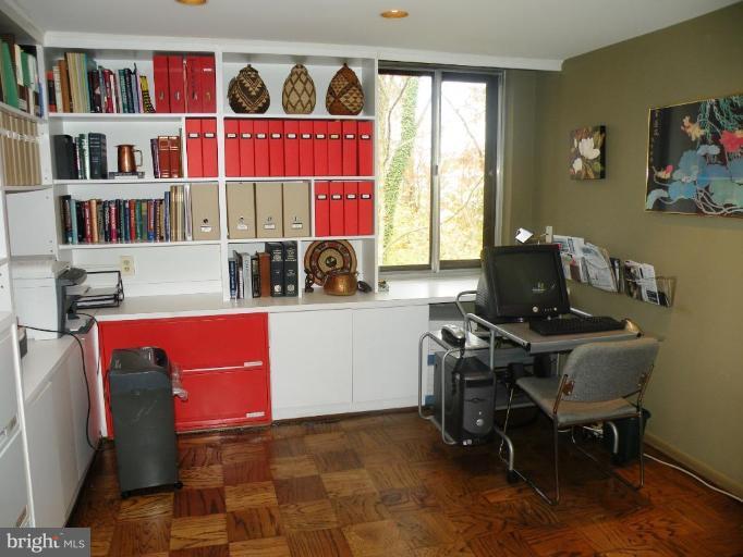 117 Cross Keys Road, Unit R117E Baltimore, MD 21210 - Photo 13 of 22 a workspace with furniture window and book shelf