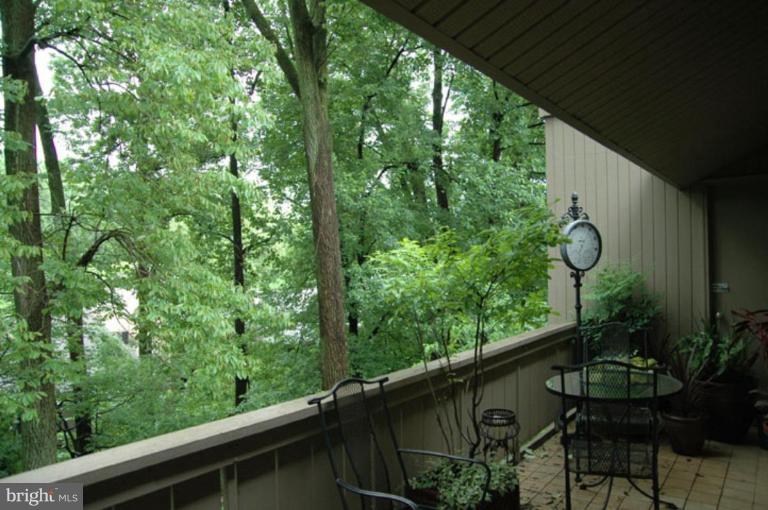 117 Cross Keys Road, Unit R117E Baltimore, MD 21210 - Photo 14 of 22 a couple of table and chairs in the balcony
