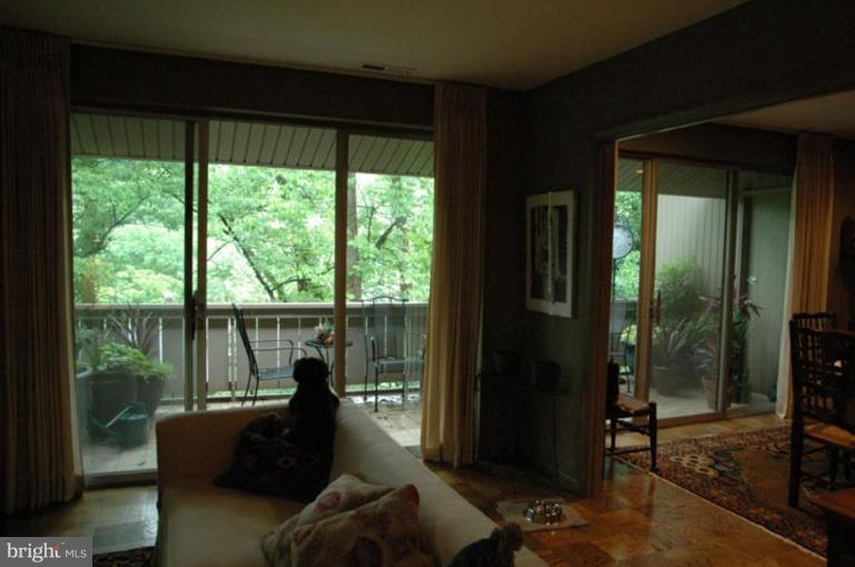 117 Cross Keys Road, Unit R117E Baltimore, MD 21210 - Photo 22 of 22 a living room with furniture and a large window