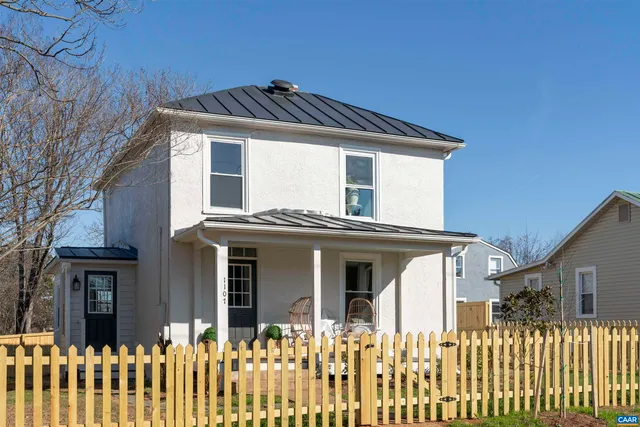 a front view of a house with a small yard