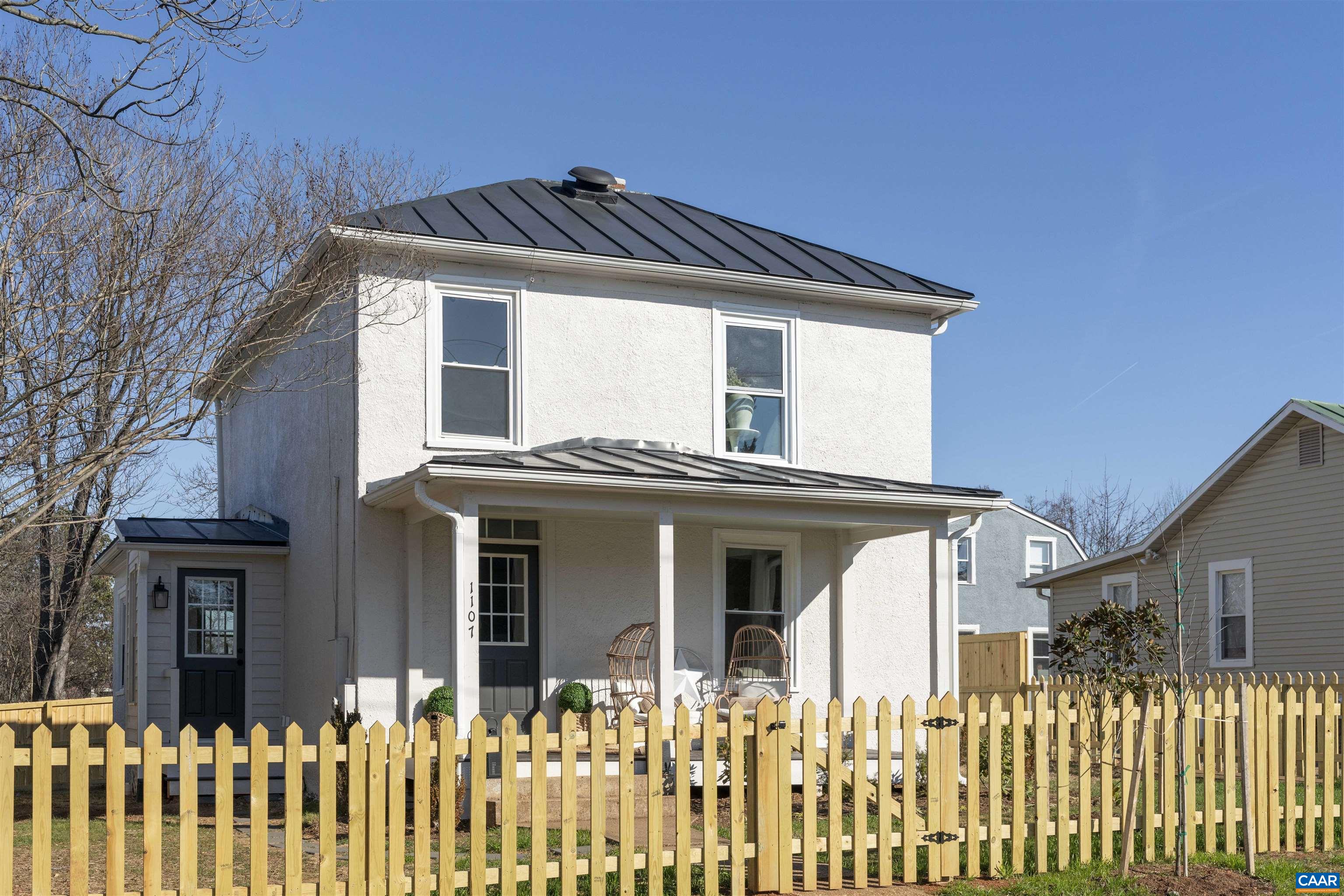 a front view of a house with a small yard