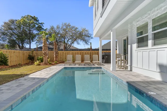 an aerial view of multiple houses with a city