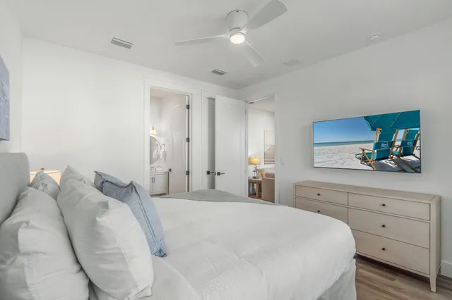 a bedroom with a large bed and a window