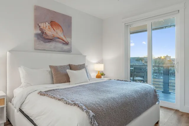 a view of backyard with a tub and wooden fence