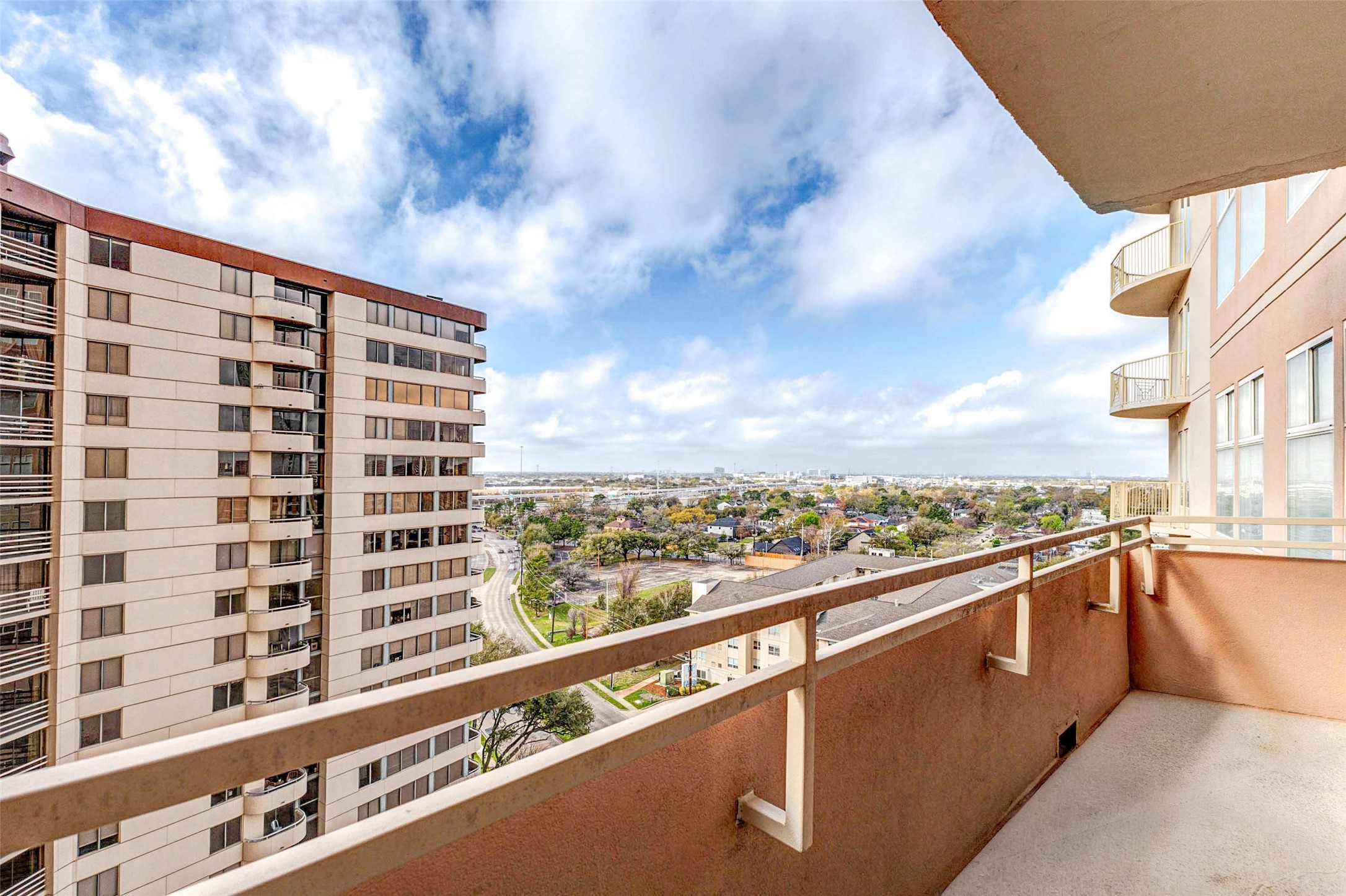 3505 Sage Road, Unit 1104 Houston, TX 77056 - Photo 23 of 31 Enjoy breathtaking elevated views from the private balcony overlooking the vibrant Houston skyline and surrounding Galleria district. From this vantage point, residents can appreciate sweeping city vistas, nearby high-rise architecture, and tree-lined streets below. The spacious balcony provides plenty of room for outdoor seating, making it the perfect place to start the day with morning coffee or unwind in the evening while taking in the expansive urban landscape.