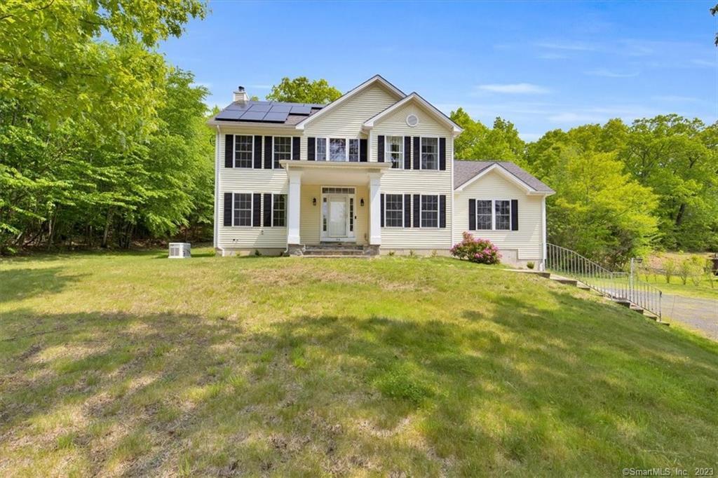 94 Beach Road Wolcott, CT 06716 - Photo 1 of 1 a front view of a house with a garden