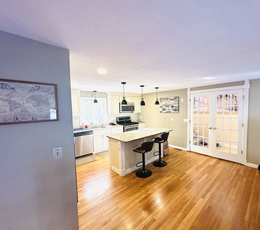 24 Seneca Drive Hudson, MA 01749 - Photo 11 of 30 a room with furniture and wooden floor