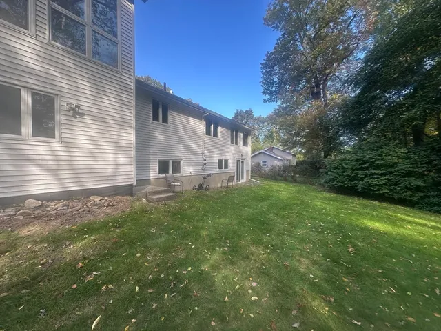 a living room with furniture and large windows
