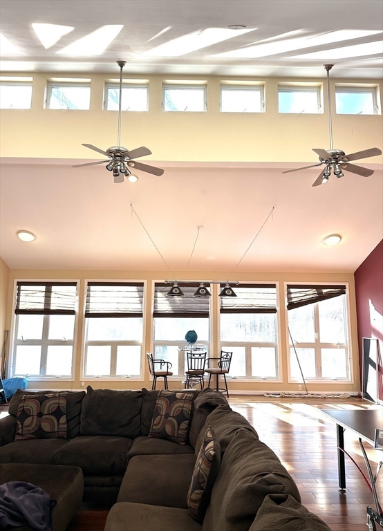 24 Seneca Drive Hudson, MA 01749 - Photo 4 of 30 a living room with furniture and a large window