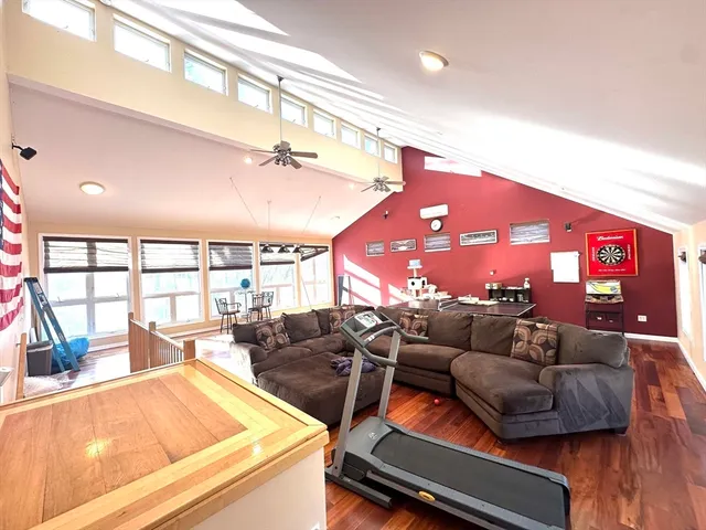 a living room with furniture and kitchen view