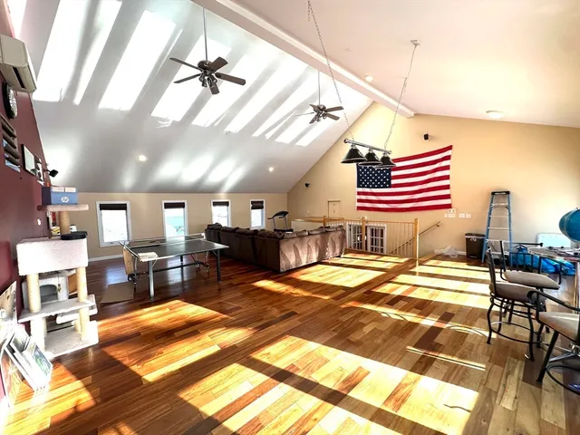 a room with furniture and wooden floor