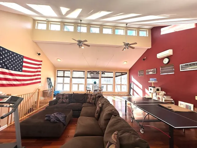 a dining room with stainless steel appliances a dining table chairs and view of kitchen