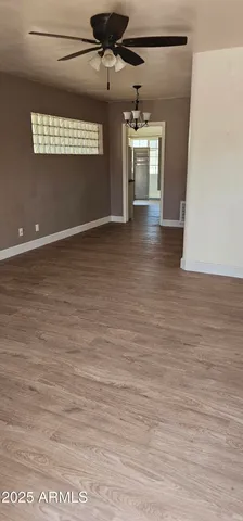 a view of a livingroom with wooden floor