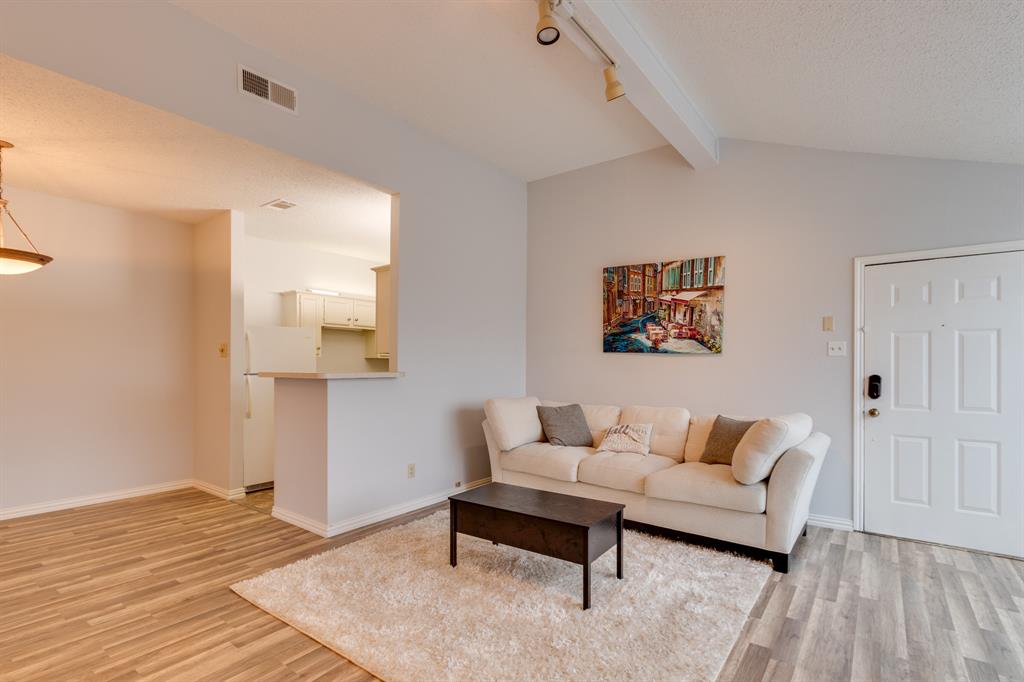 2100 Randy Snow Road, Unit 412 Arlington, TX 76011 - Photo 5 of 32 a living room with furniture and a wooden floor