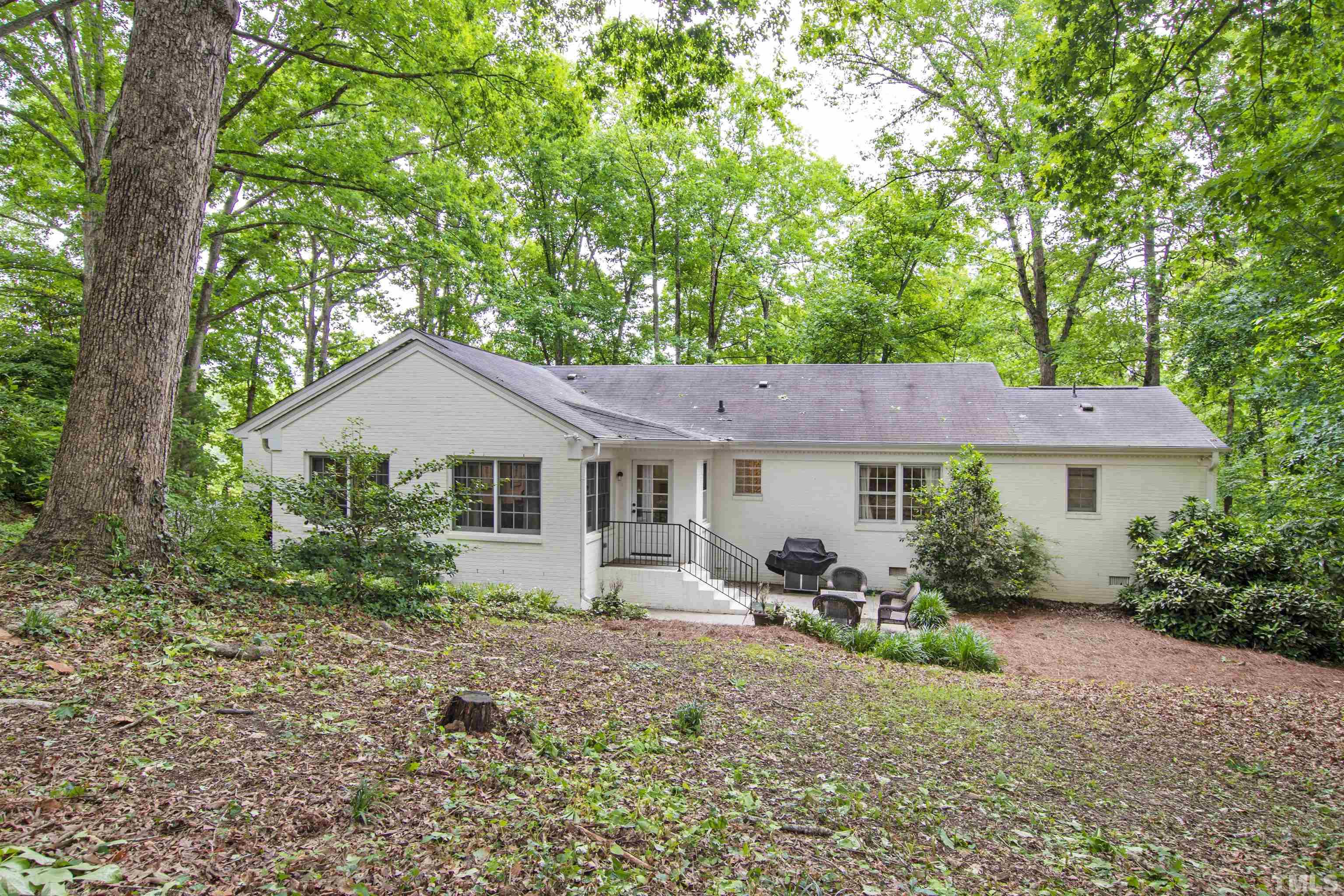 713 Brunswick Street Raleigh, NC 27609 - Photo 29 of 32 a front view of a house with garden