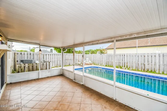 a view of a porch with a small yard
