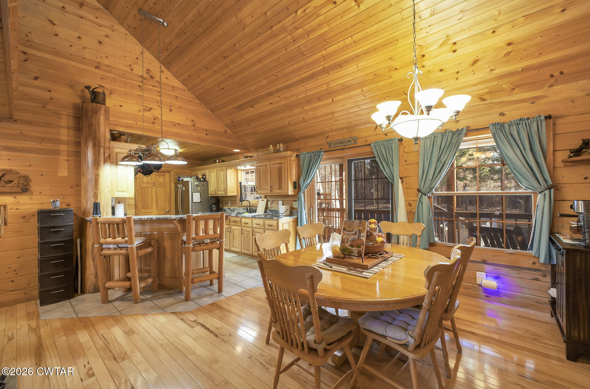 372 Aubrey Fergerson Road Gadsden, TN 38337 - Photo 11 of 50 a view of a dining room with furniture and chandelier